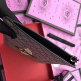 Bee print GG Supreme pouch